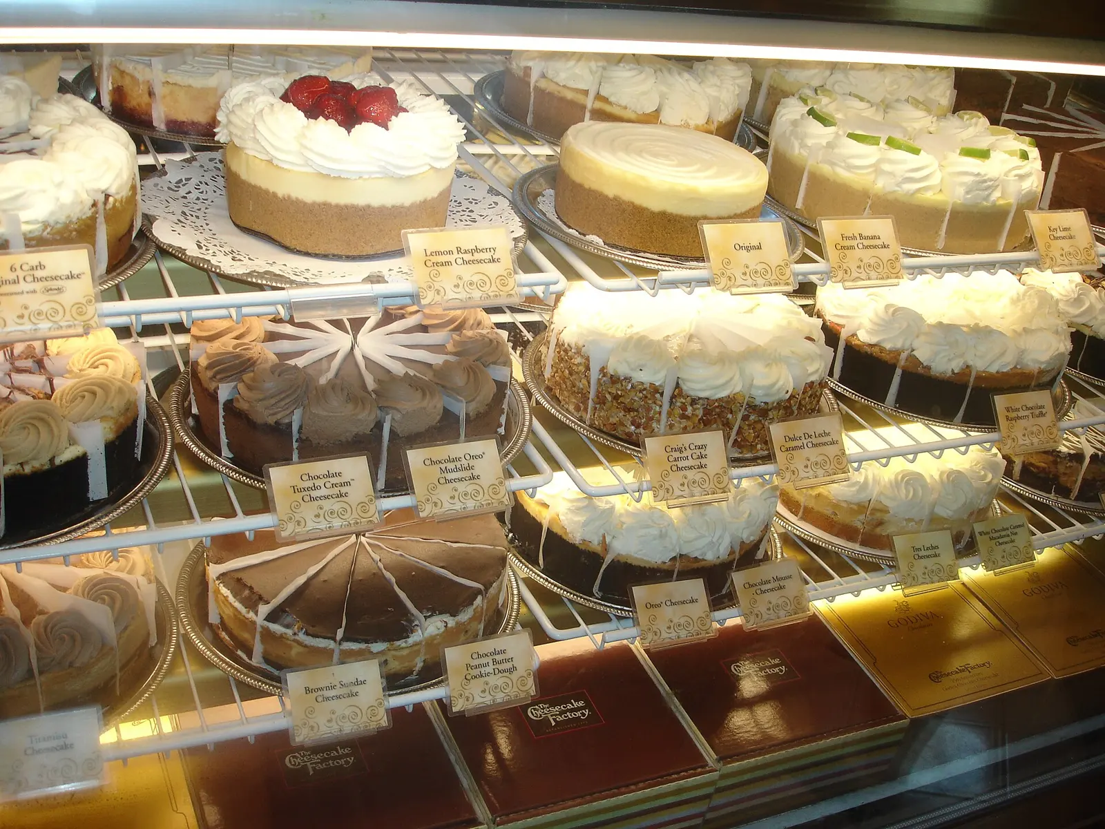 Several cheesecakes in a display case at The Cheesecake Factory in Naples, Florida.