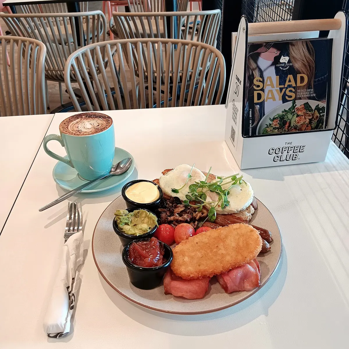 Club Big Breakfast with large cappuccino, The Coffee Club Riverton: described as 'Eggs, bacon, mushrooms, chipolatas, freshly smashed avo, hash brown, confit cherry tomatoes,...