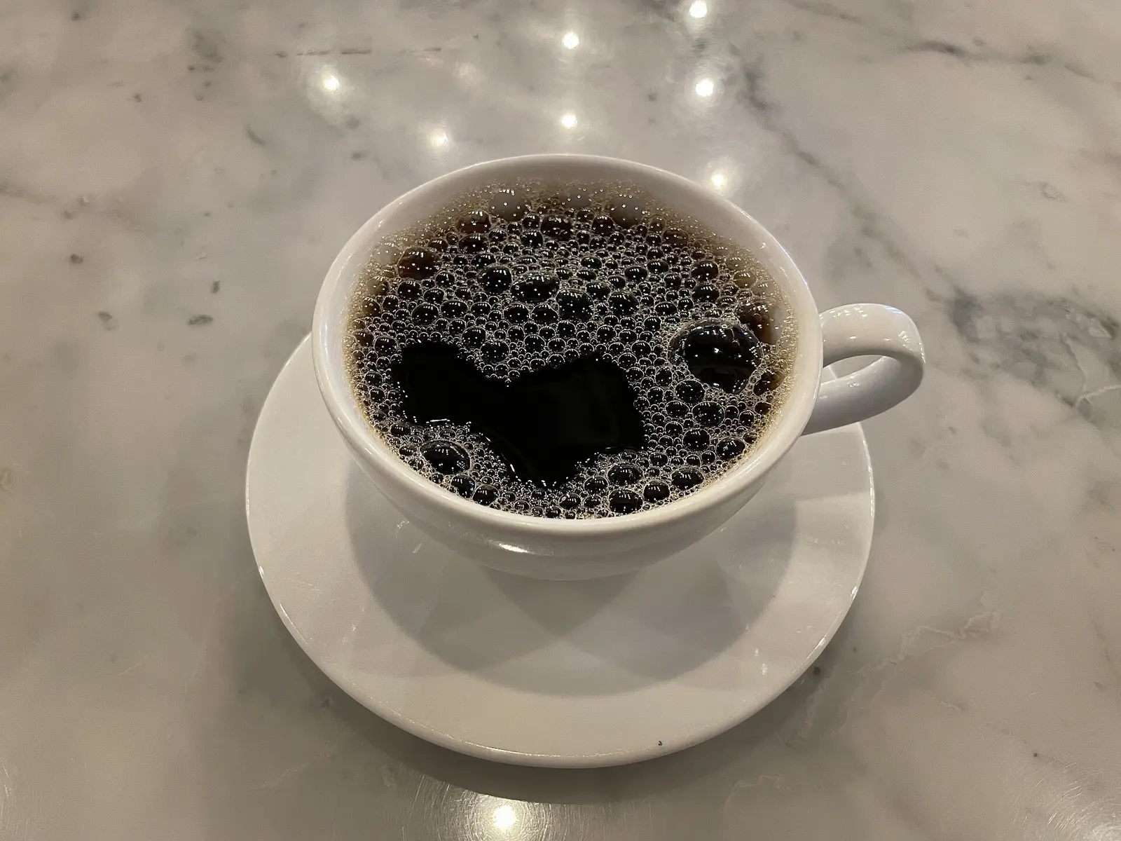 Cup of coffee on café table