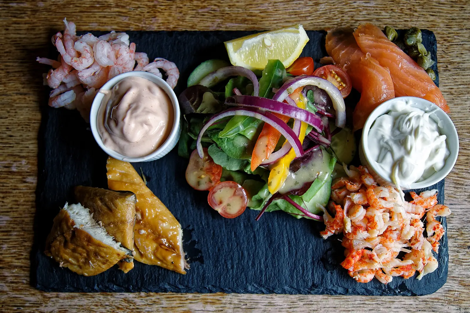 Fish platter with prawns, crayfish, smoked salmon, mackerel, lemon mayonnaise, marie rose sauce and salad, at the 17th-century Black Horse Inn on Nuthurst Street in Nuthurst ,...