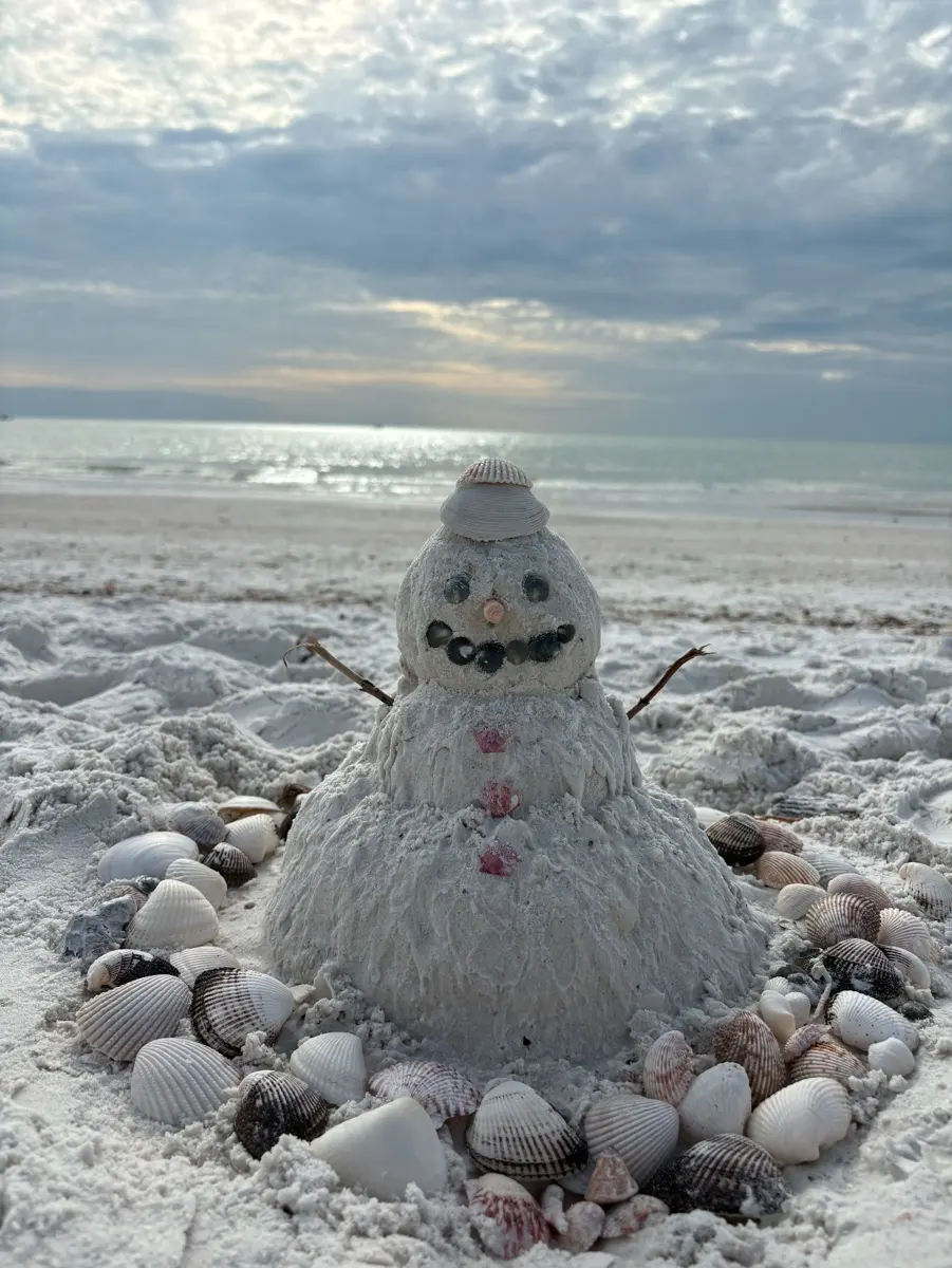A sand snowman found on the beach at Marco Island, Florida during Christmas time
