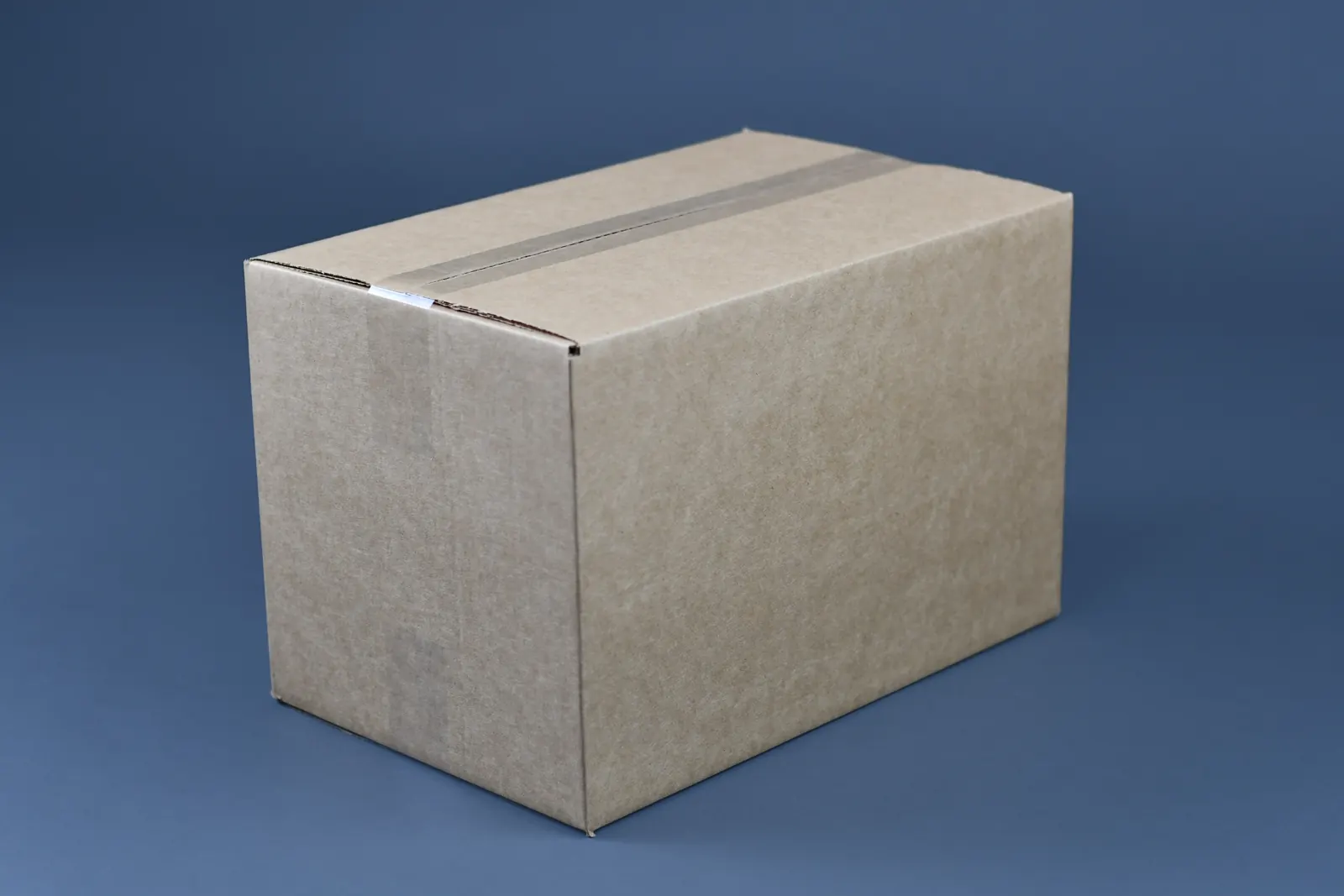 A small moving box taped closed