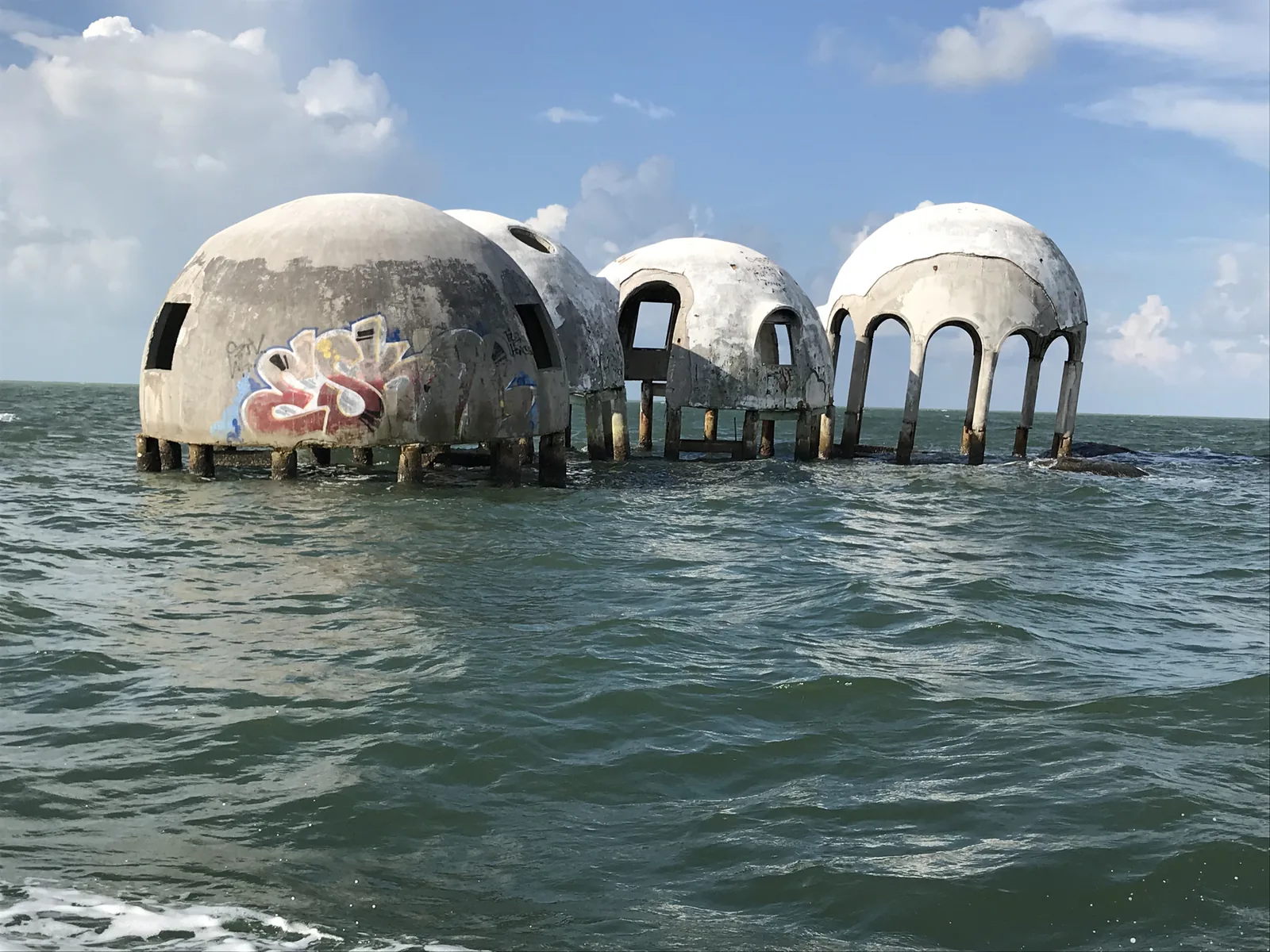 The Cape Romano dome houses still standing above the water in August 2019